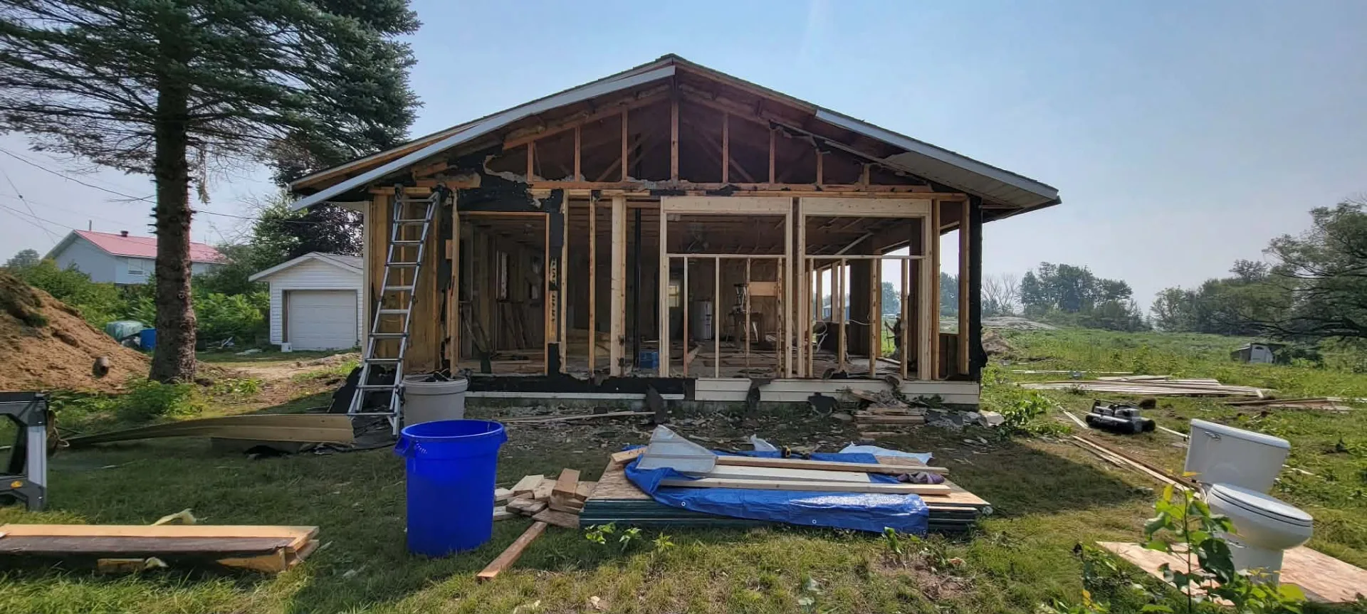 Fairway renovation in progress showing exposed wood framing